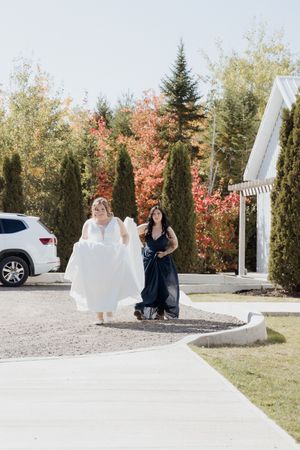 Bride arriving for the first look at the Grand Ivory in Moncton wedding photography colourful fall leaves October outdoor wedding ceremony