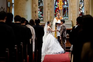 Timelapse series showing key moments of a wedding ceremony in a traditional church setting with stained glass windows.