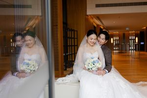 Interior hallway wedding photos with warm lighting and elegant decor.