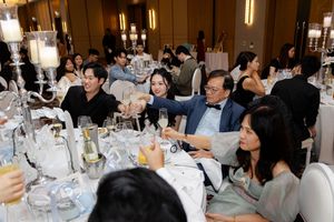 Wedding reception guests cheers to the newley weds Ritz-Carlton wedding reception