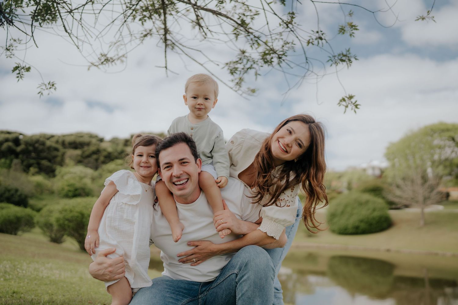 Family having fun together in a sunny outdoor setting.