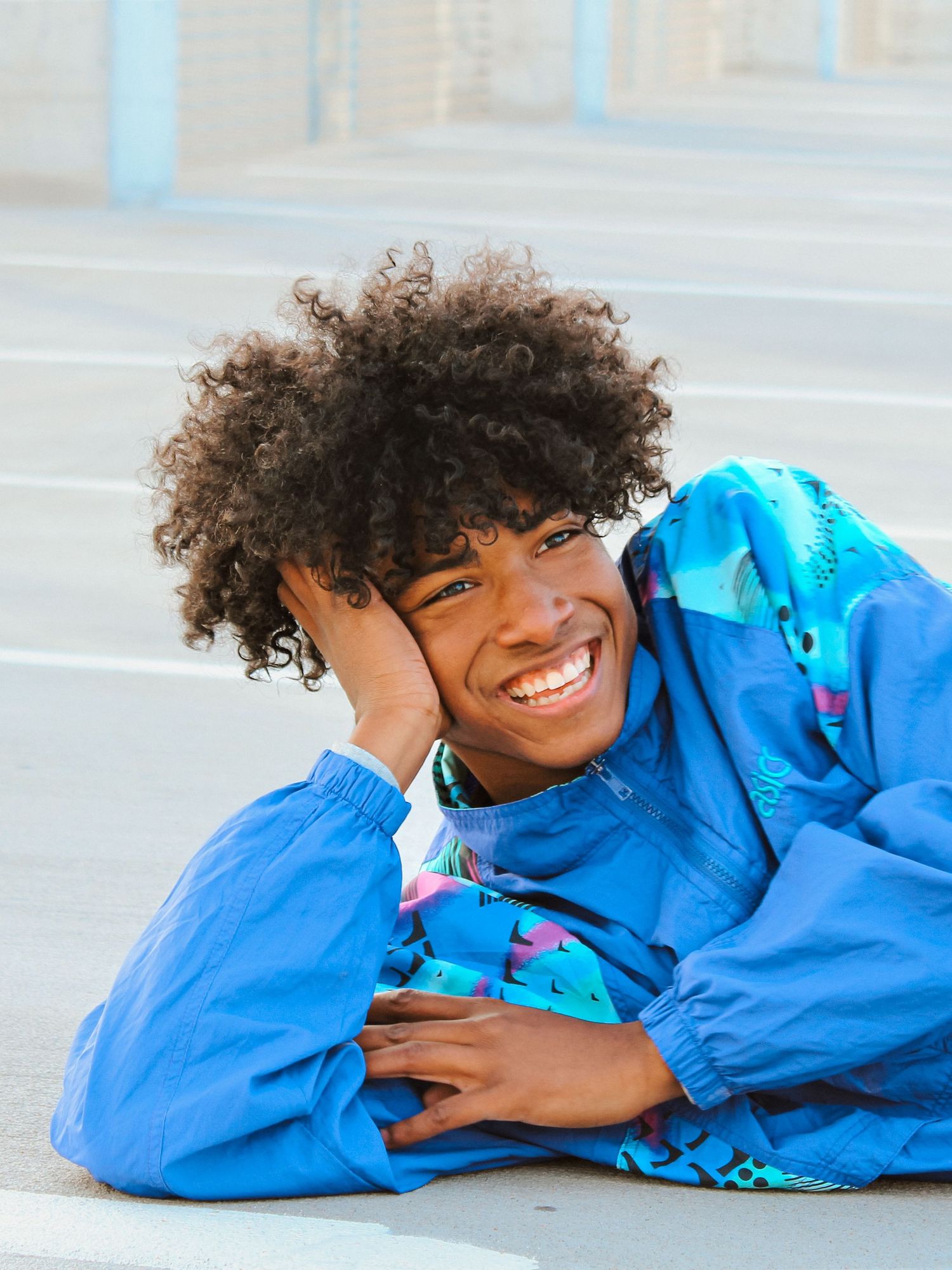 Putnam City Original Smiles in Senior Portraits at Arts Parking Garage