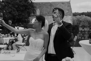 Black and white photo captures candid wedding celebration moments.