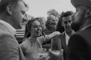 Black and white candid shot of wedding celebration emotions.
