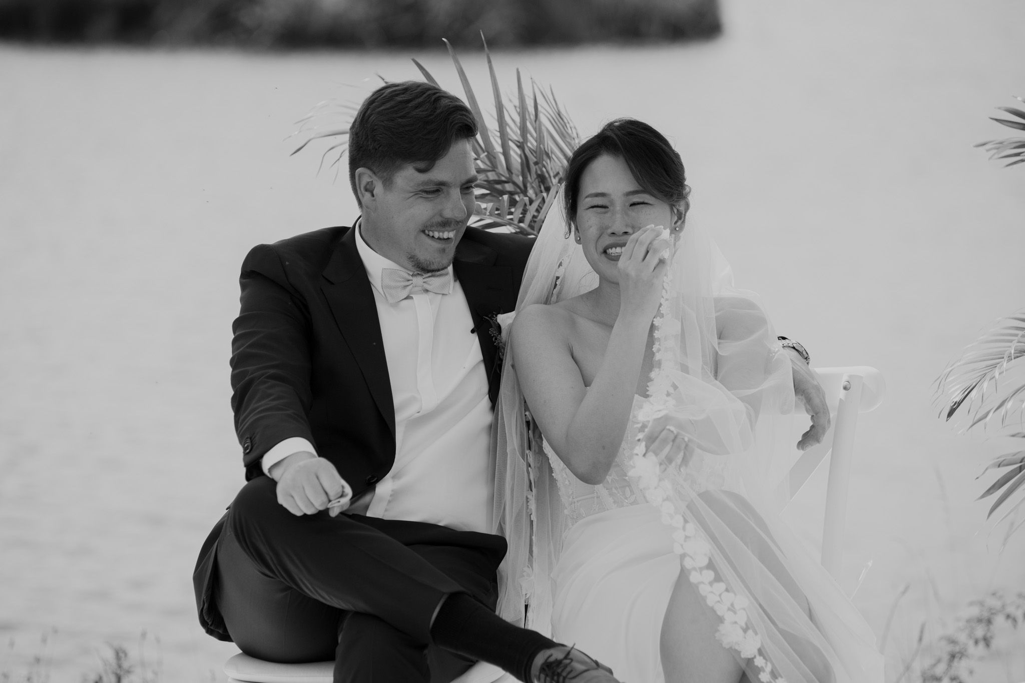 Black and white candid moment from an intimate wedding ceremony.