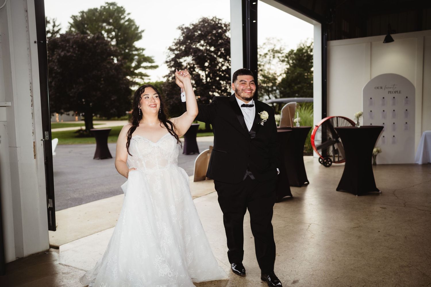 Bride and groom dancing together at their wedding reception in an elegant venue.