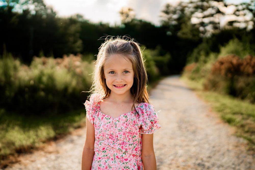 A series of soft-focus nature photography shots with a pink floral dress visible in some frames.