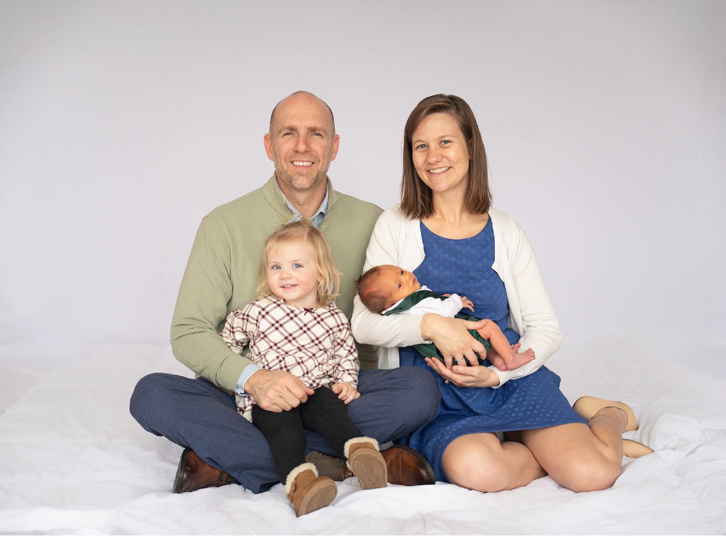Newborn baby boy with family in natural light studio by Bartlesville Photographer Kristi Bray