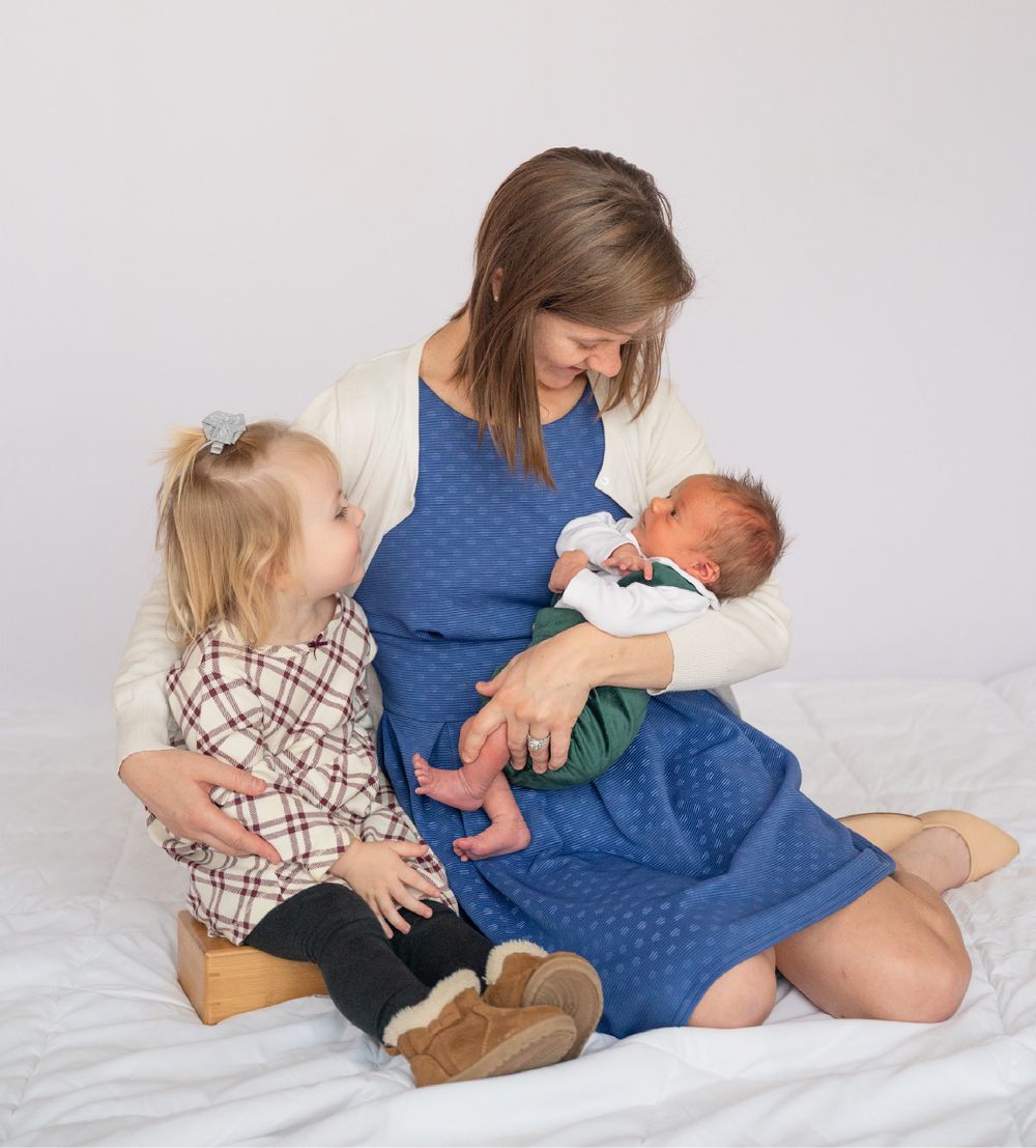 Newborn baby boy with family in natural light studio by Bartlesville Photographer Kristi Bray