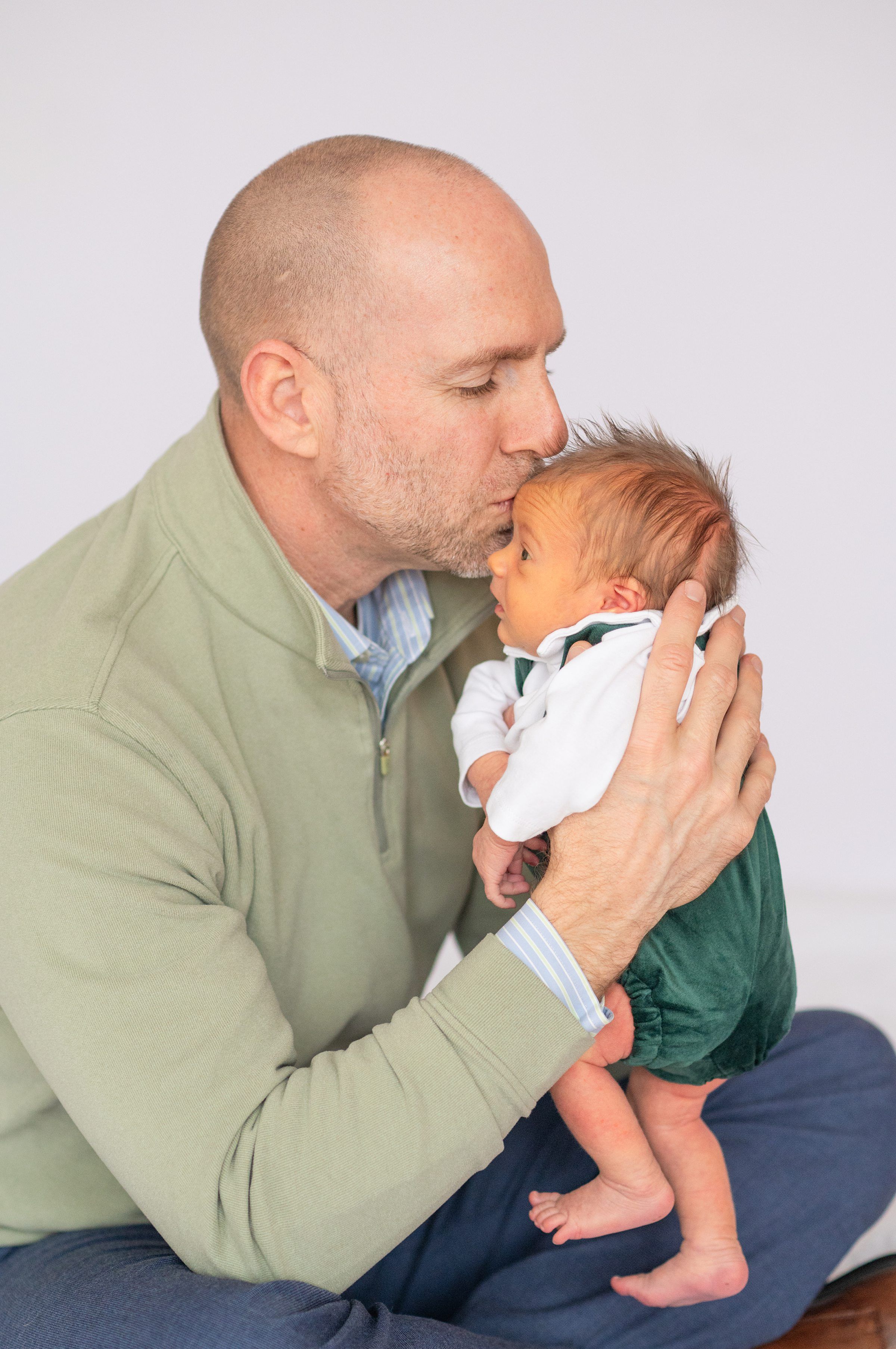 Newborn baby boy with family in natural light studio by Bartlesville Photographer Kristi Bray