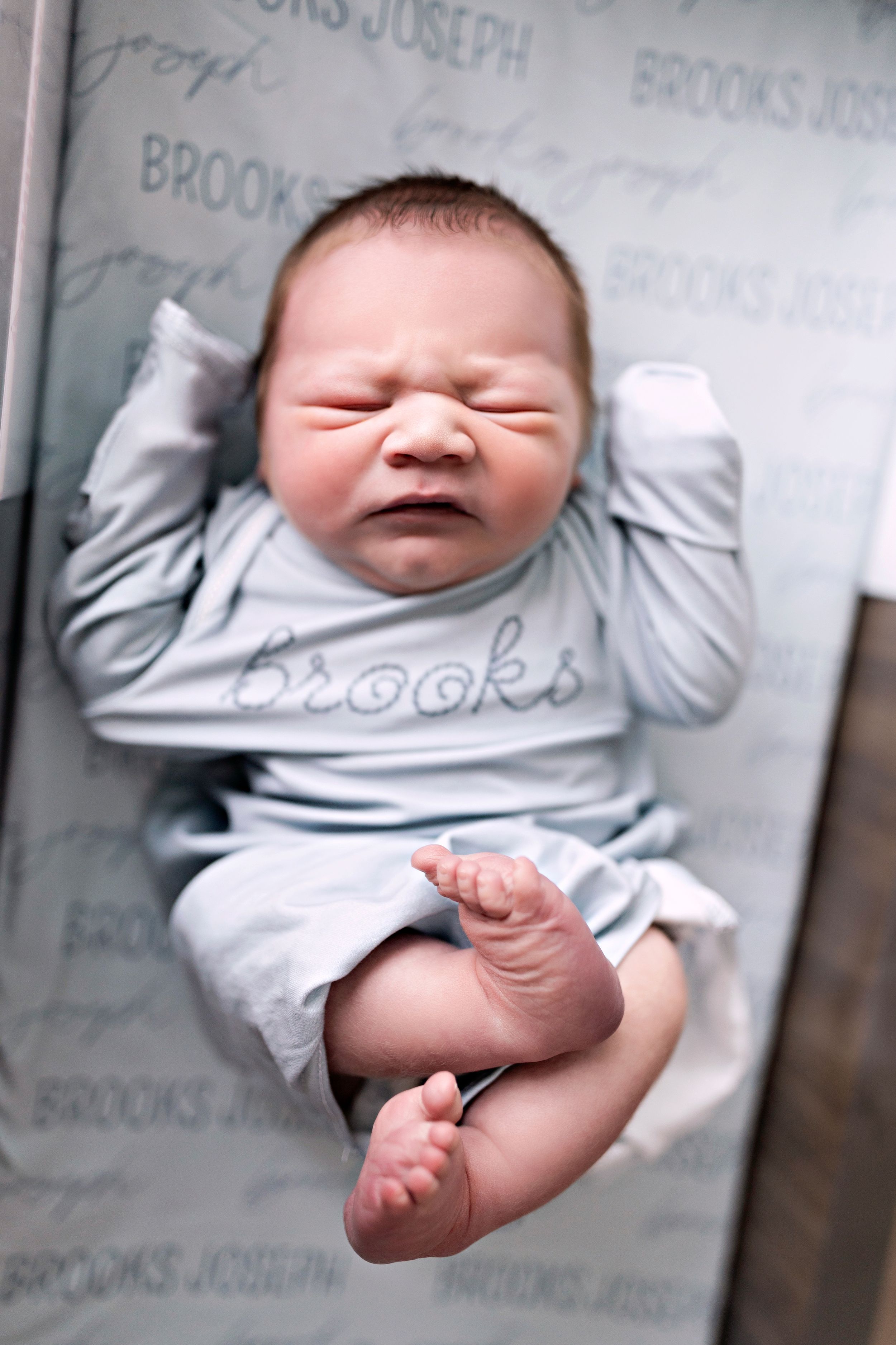 Series of expressive newborn portraits showing different facial expressions.