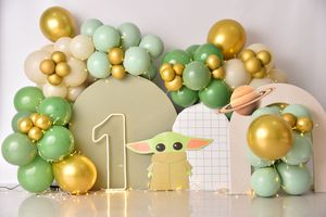 Green and gold balloon arch with Baby Yoda theme and number one decoration.