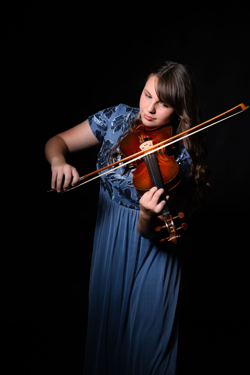 Close-up shot of violin being played with elegant bow technique.