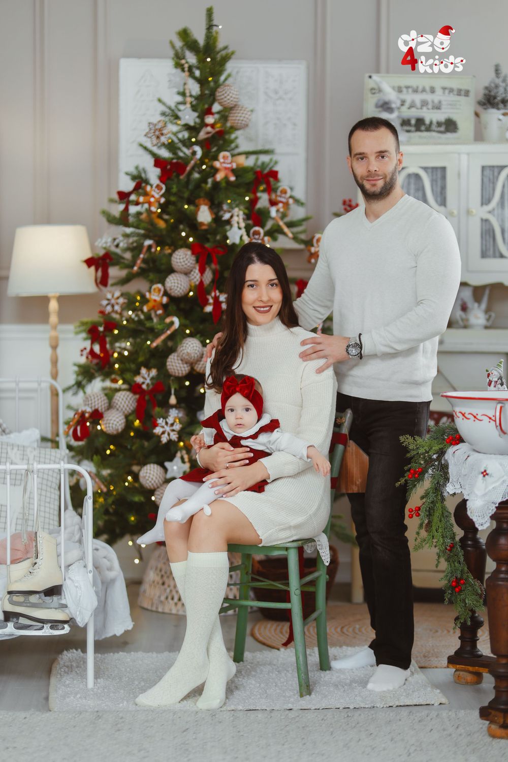 Festive Christmas scene with decorated tree and interior decor in a bright white room.