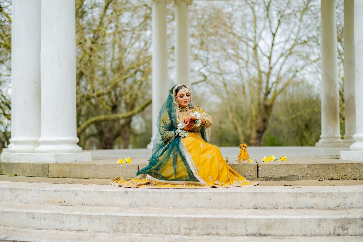 Mehndi portrait beneath a garden pergola