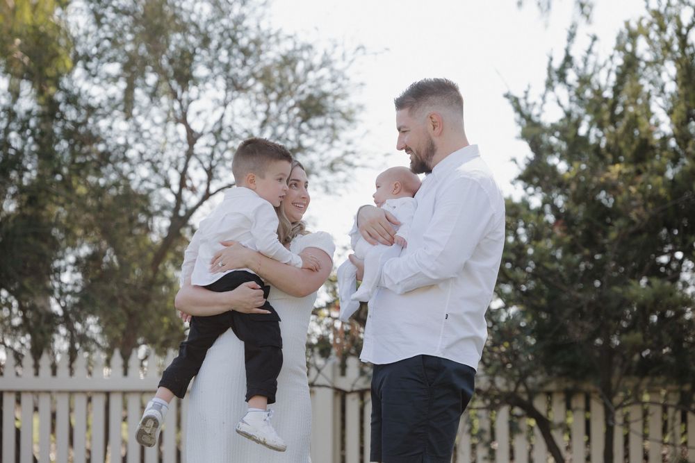 Two people in white shirts embrace and dance together on an outdoor patio during what appears to be a special occasion.
location shepparton