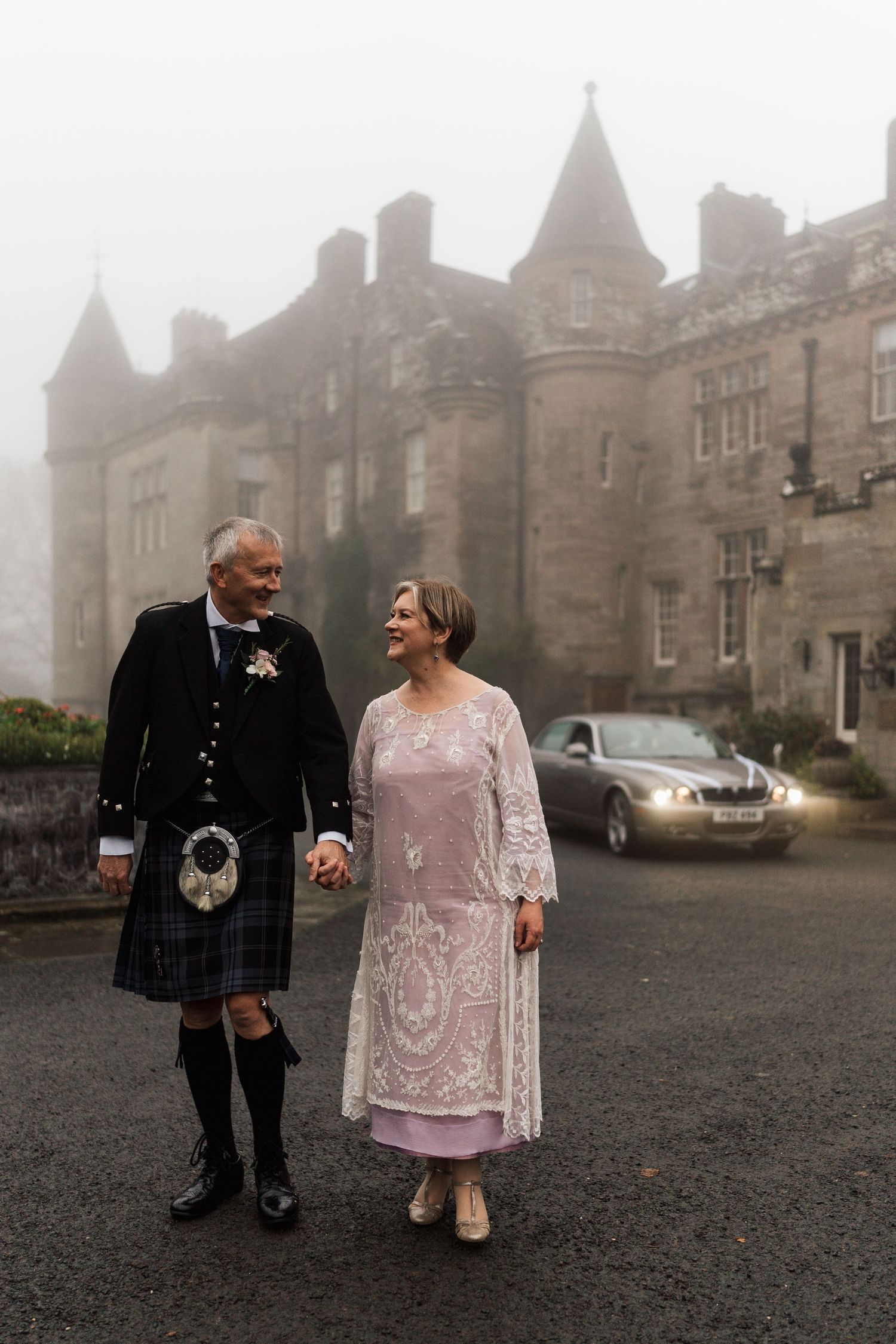 P&C at Glenapp castle on their misty wedding day. relaxed candid shot