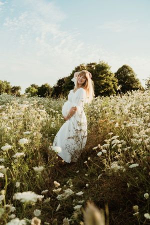 Ethereal photos in a blooming white wildflower field at sunset based in Cheltenham