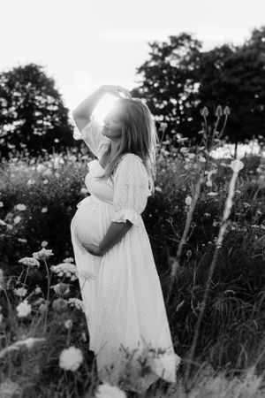 Black and white portraits among wild flowers and tall grass.