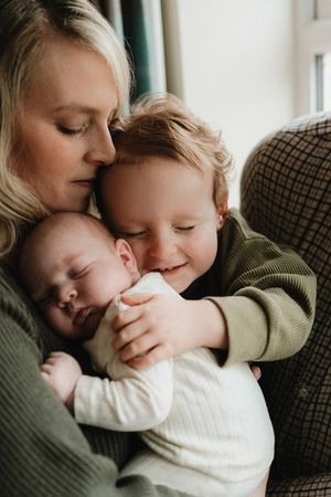 Tender moment captured during newborn session pausing time photography Cheltenham