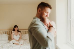 Intimate bedroom scene with soft morning light streaming through a window.