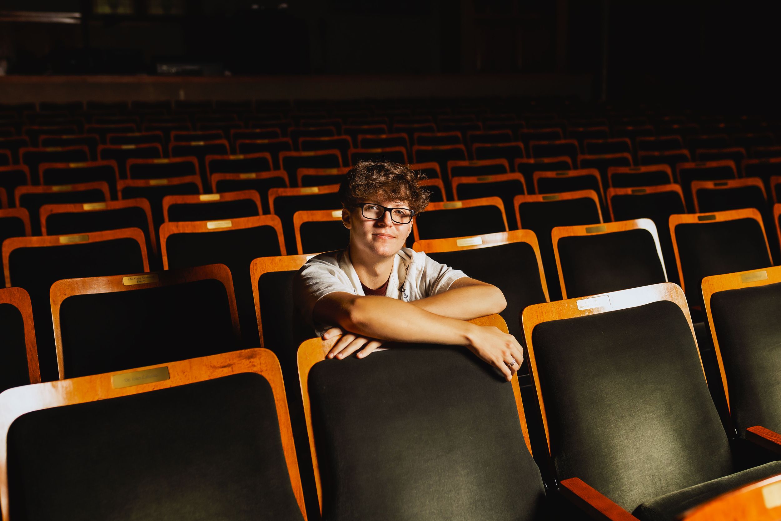 Person sitting alone in empty theater with orange chairs.
Janesville, WI
Brodhead, WI