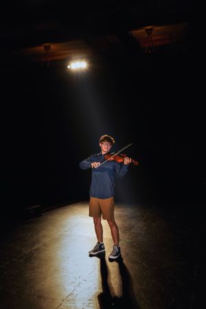Person playing violin under spotlight on dark stage.
Janesville, WI
Brodhead, WI