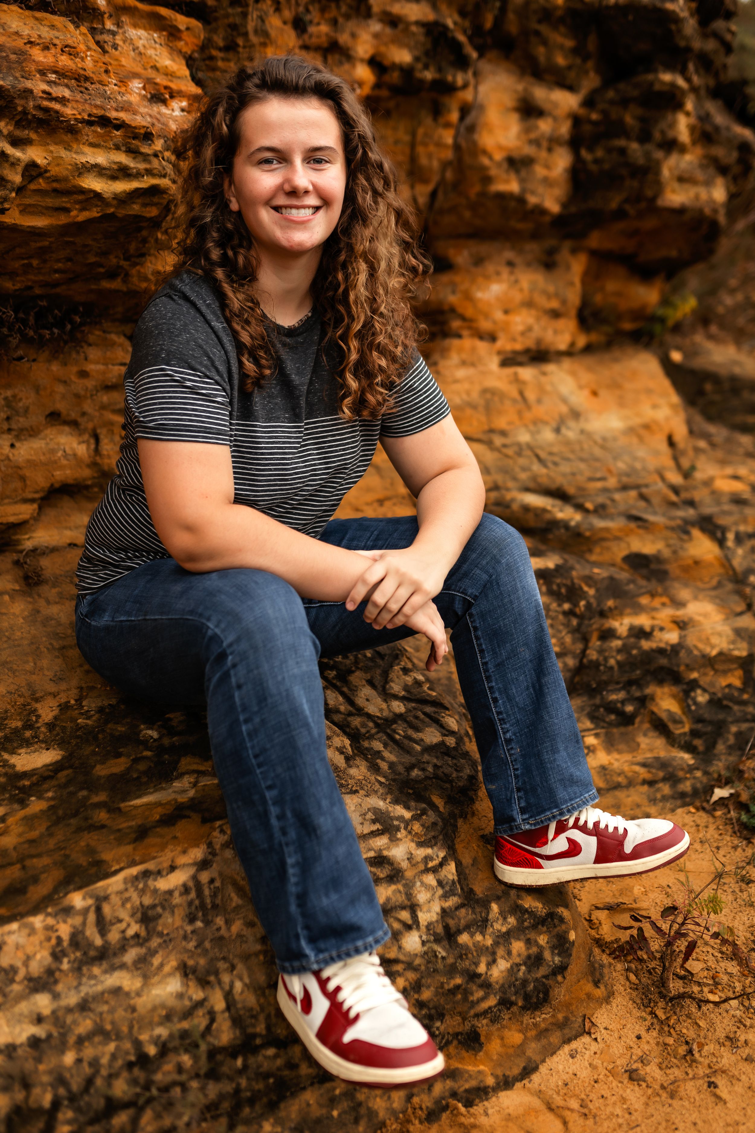 Casual outdoor portrait with red and white sneakers against orange rock formation.
Janesville, WI
Brodhead, WI