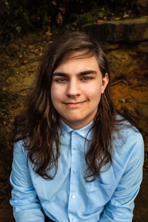 Portrait of someone wearing a light blue button-down shirt seated against a natural outdoor background.
Janesville, WI
Brodhead, WI