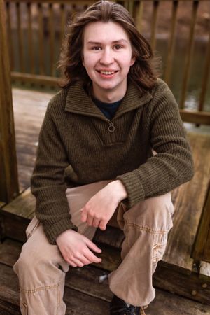 Person in brown sweater and khaki pants sits casually on wooden deck with a warm smile.
Janesville, WI
Brodhead, WI
