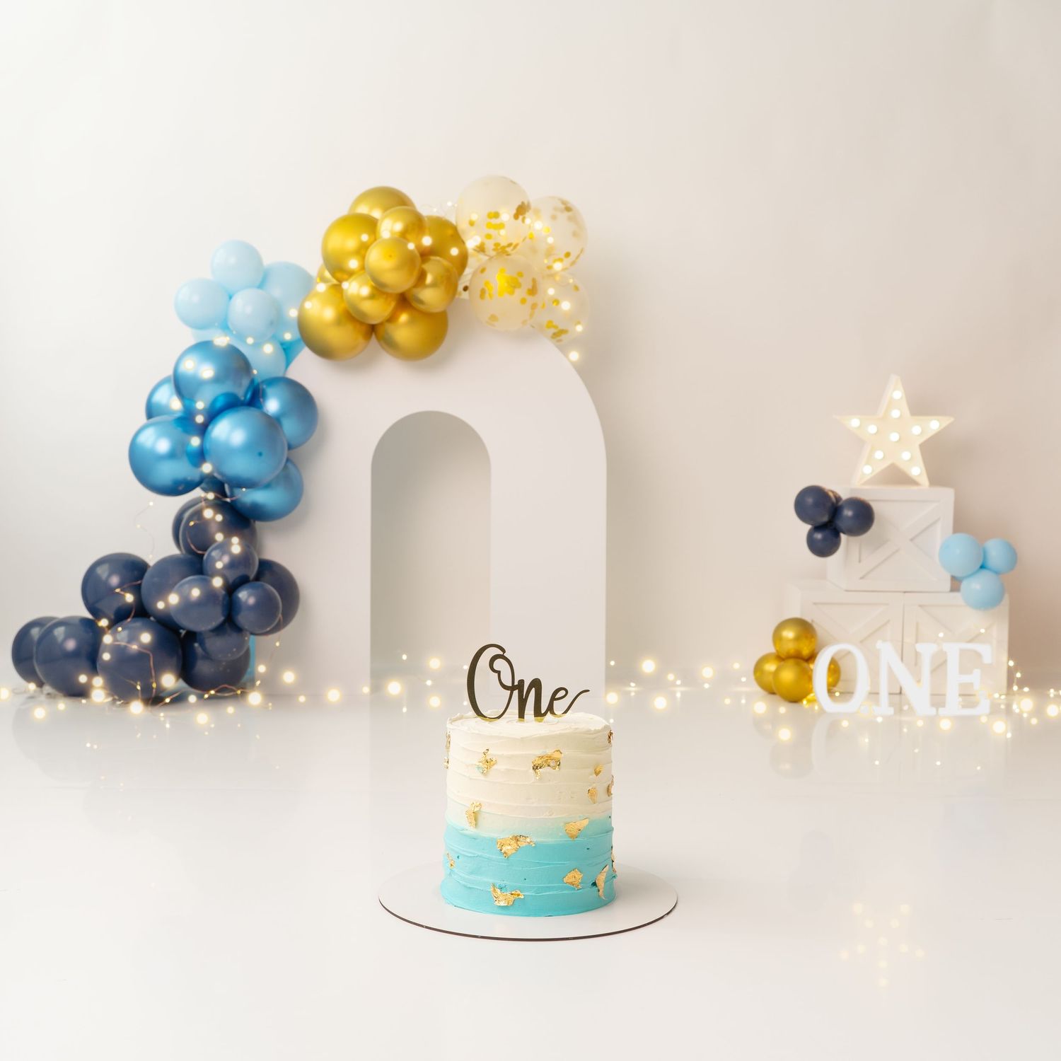 Simple, yet elegant 1st birthday cake smash setup