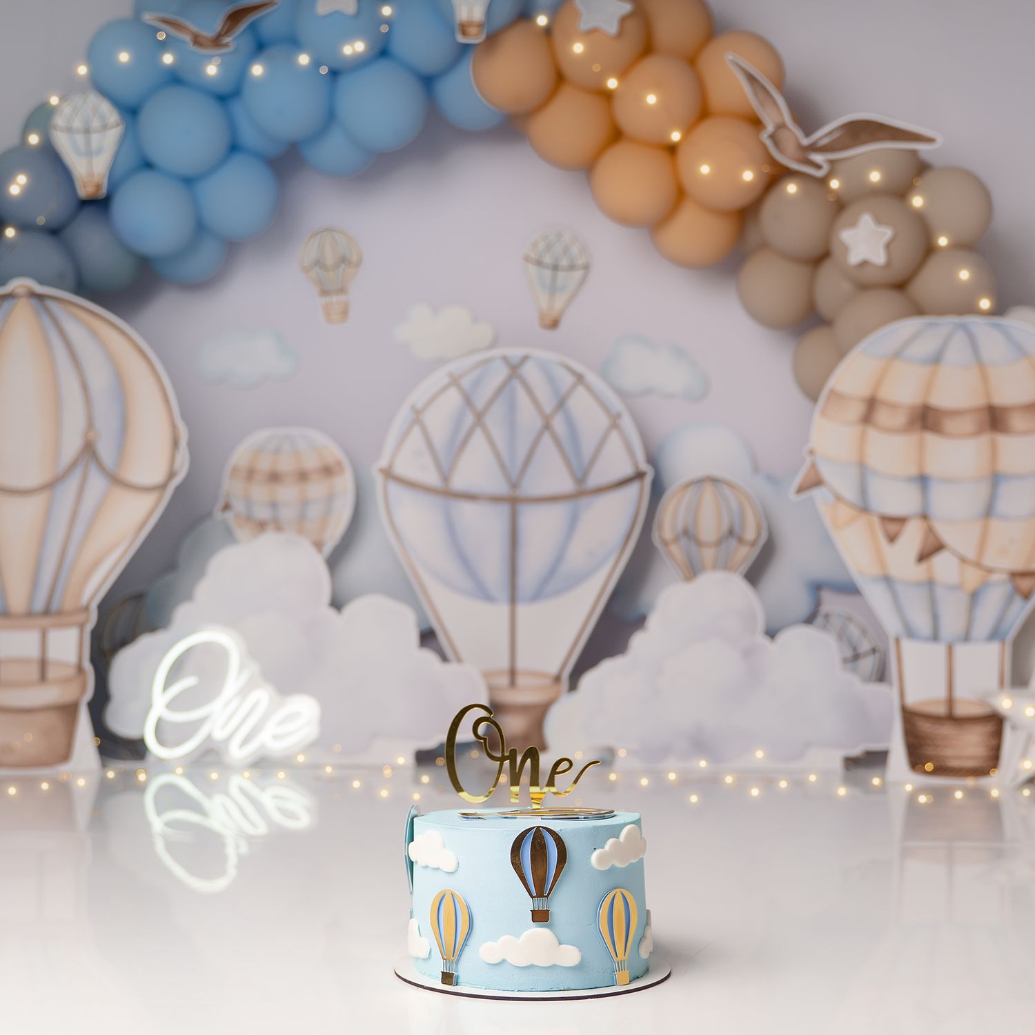 Beautiful Hot Air Balloon Cake smash setup for a boy's first birthday in Hayes, West London, Hillingdon