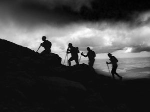 Black and White silhouette shot of ultra runners climbing Cadair Idris