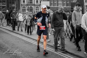 Ultra Runner crossing swing bridge in Whitby