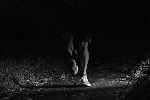 Ultra runners legs, lit up by flash on Cheshire Ring 100