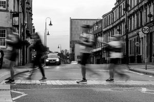 Motion blur photo of ultra runners crossing a road on Cheshire Ring 100