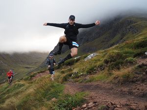 Sky Runner jumping in front of Ben Nevis