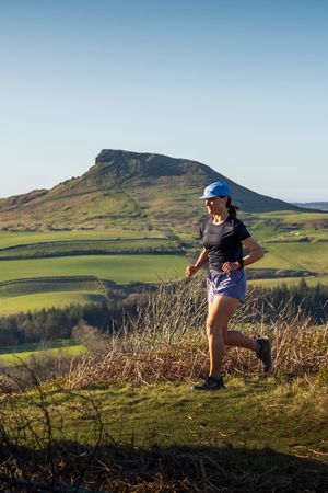 Runner in front of Roseberry Topping, North Yorkshire