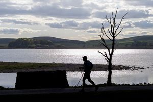 Ultra Runner passing Malham Cove