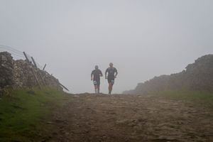 Trail Runners in the fog on Cam High Road, Yorkshire Dales