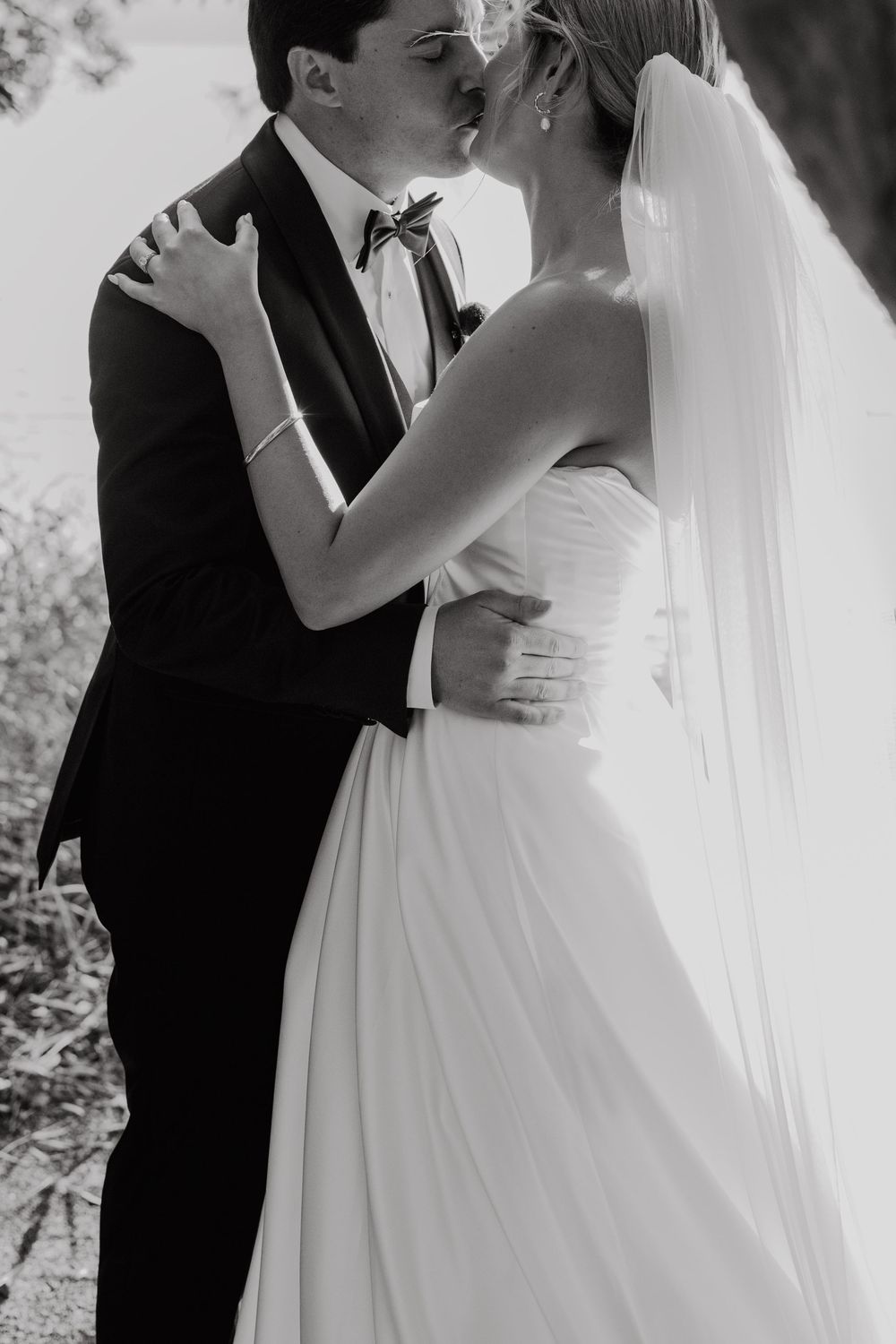 Intimate black and white wedding portraits capturing romantic moments.