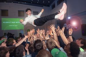 Teen crowd surfing at Reuben's Bar Mitzvah celebration party on March 28, 2024.