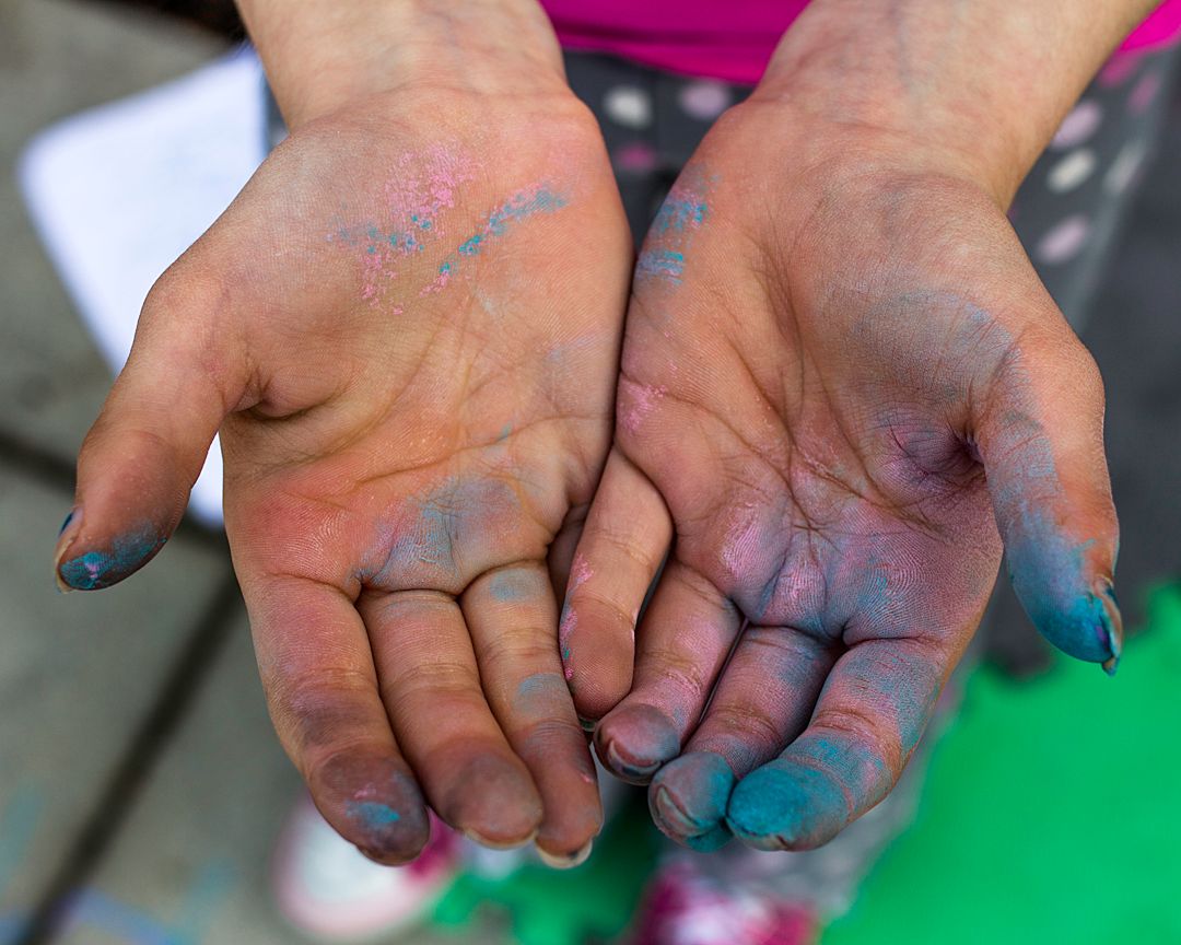 hands with blue paint