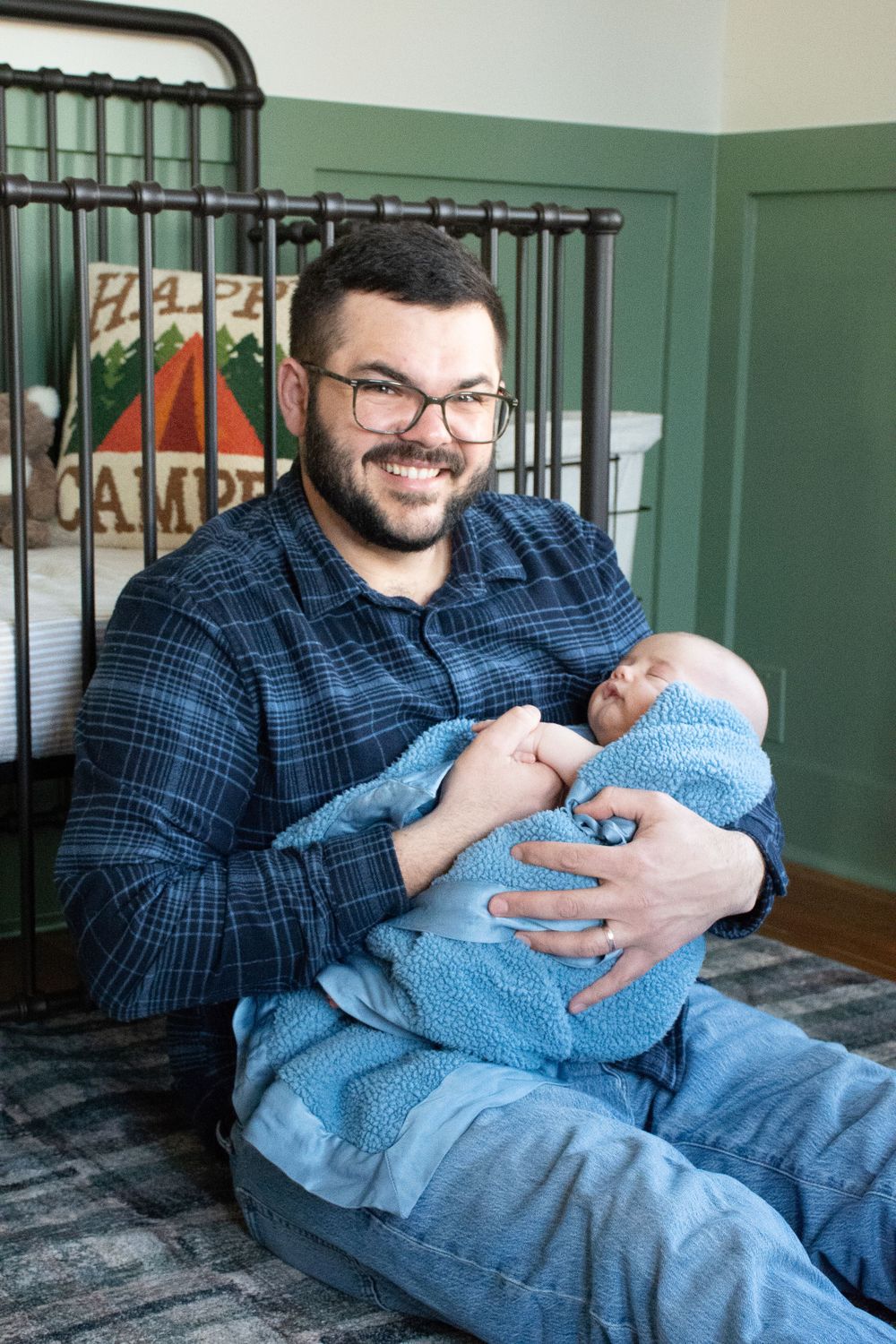 a dad holding a baby