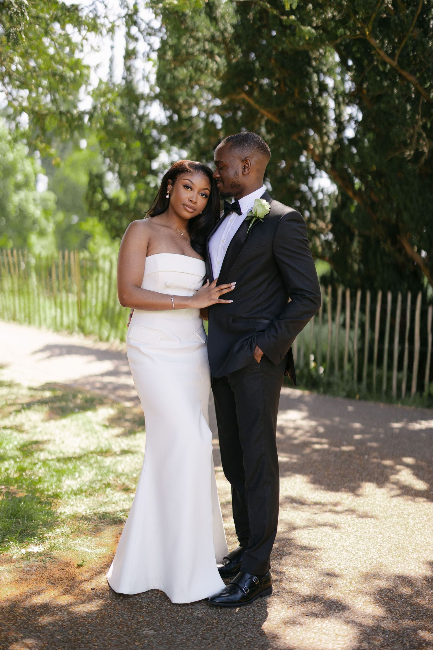 Elegant sheer tulle bridal gloves with delicate detailing shown on arms against a white background.