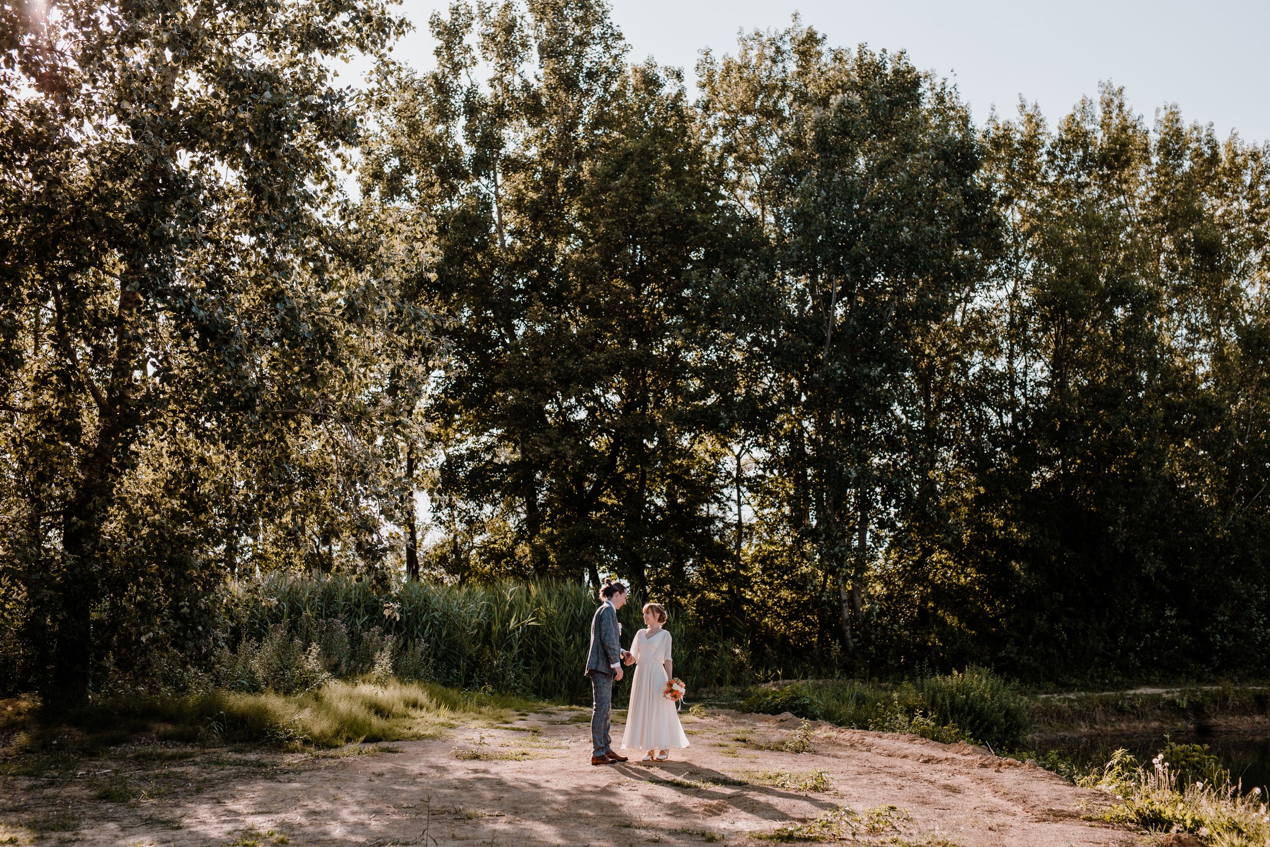 Romantic wedding photography session by a tranquil lakeside in Croatia.