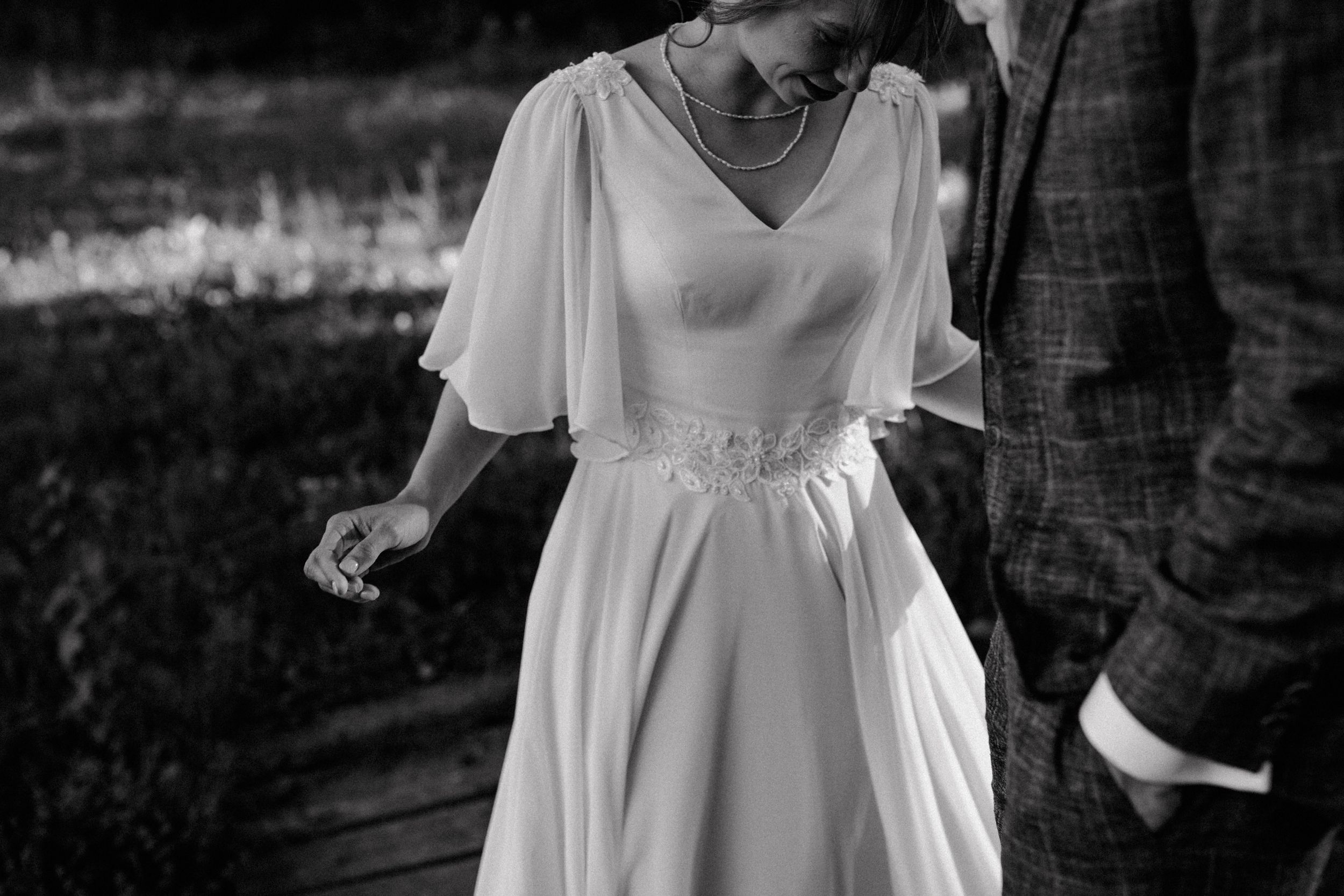Candid moment captured trough wedding photography in intimate wedding session.