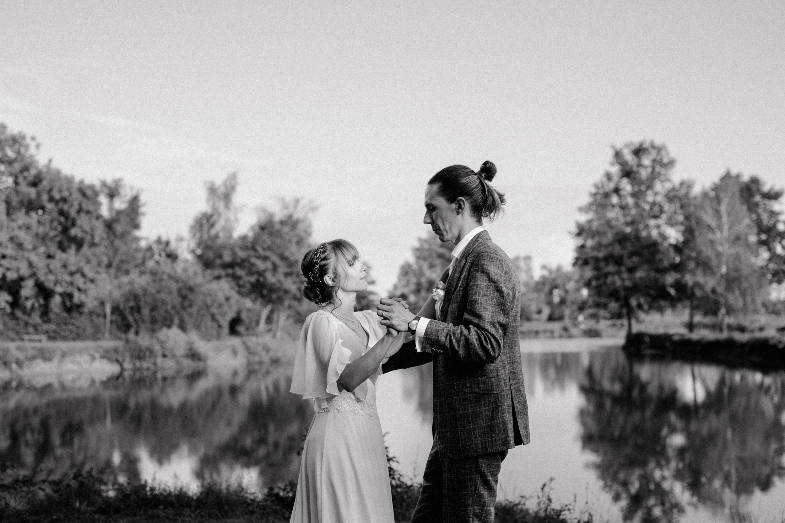 Couple practicing their first dance by the lake during their wedding session in Croatia