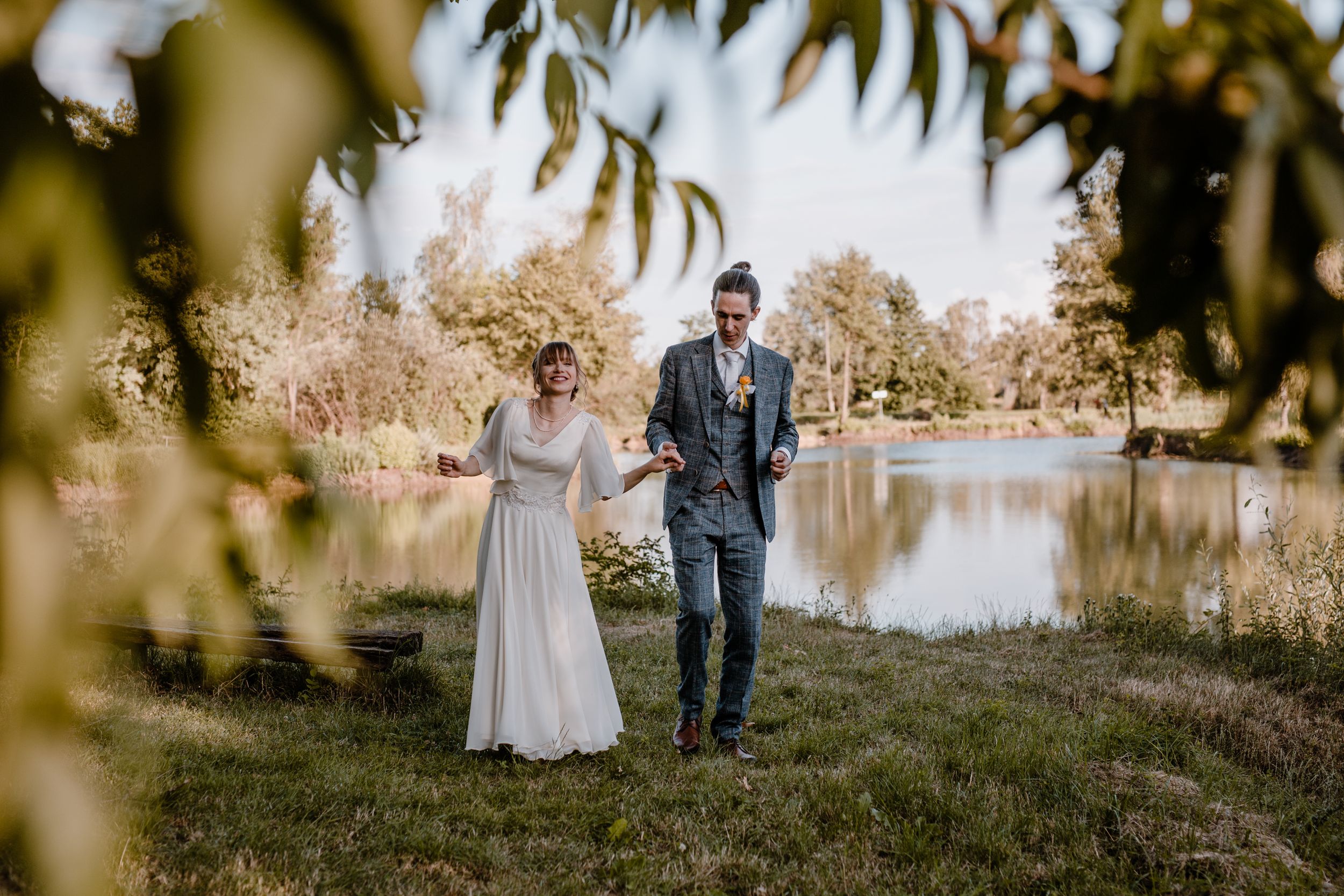 Sweetest couple practicing their first dance by the lake in golden hour captured trough wedding photography.