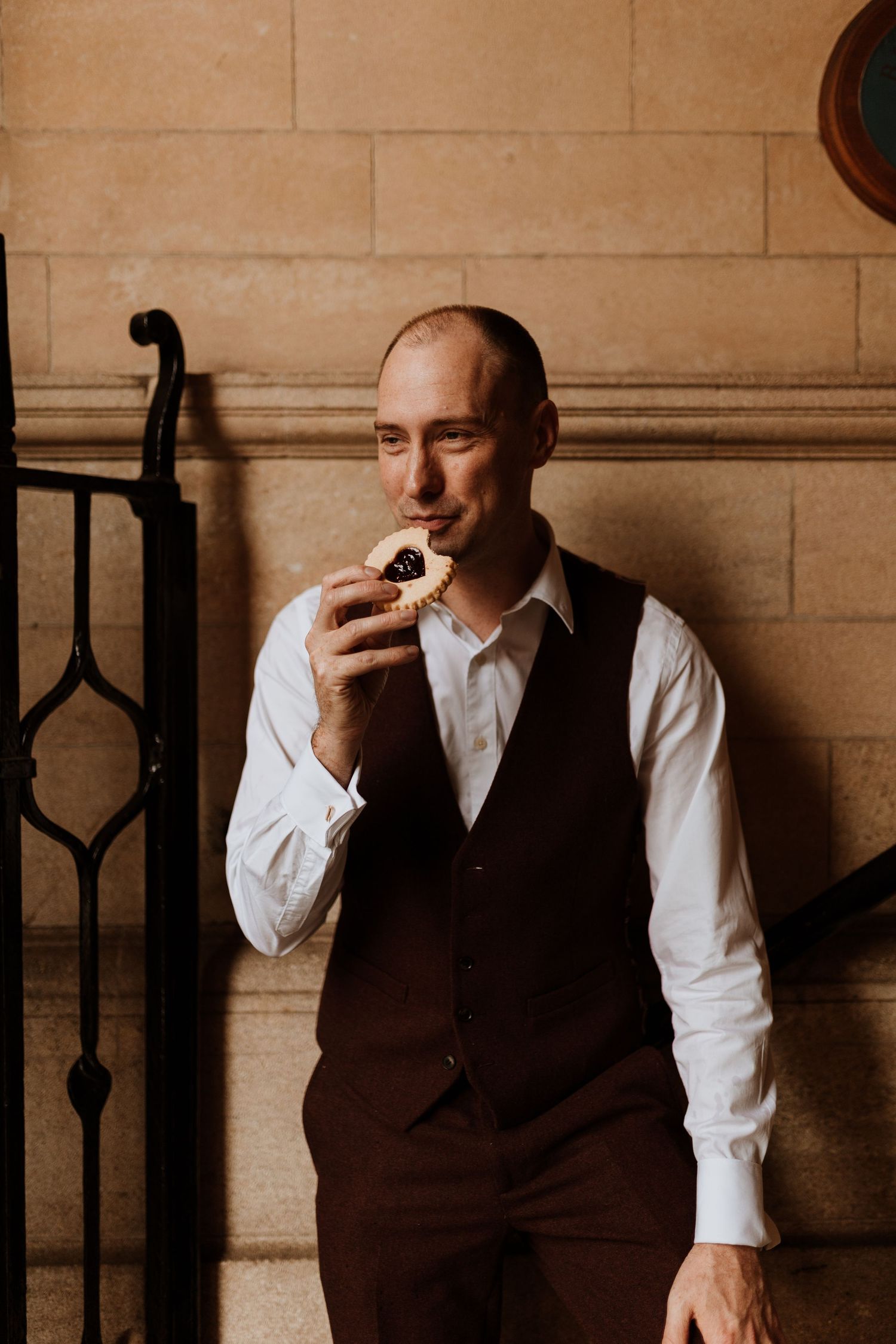 Groom enjoying a giant jammy dodger before ceremony